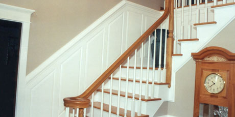 Wainstotting on stairways and walls provides an intriguing accent to your home