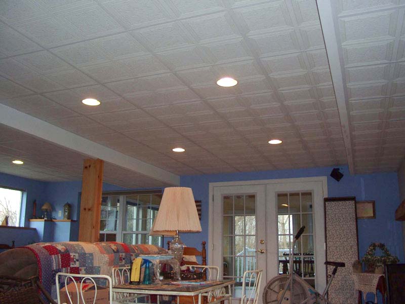 This basement features a walk-out to a deck through french doors installed by Kelley Carpentry